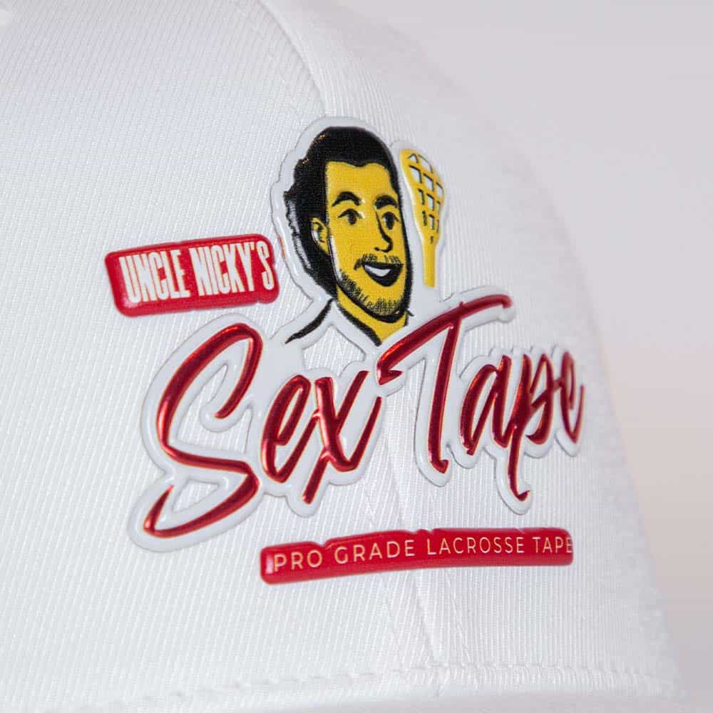 Close-up of Uncle Nicky’s embroidered logo on white performance hat
